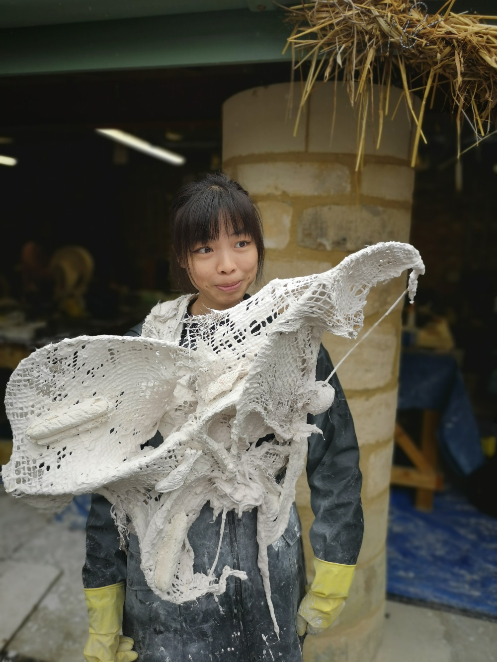 Fashion student with plaster garment